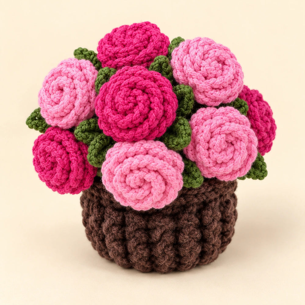 Hand-crocheted pink roses and textured brown base