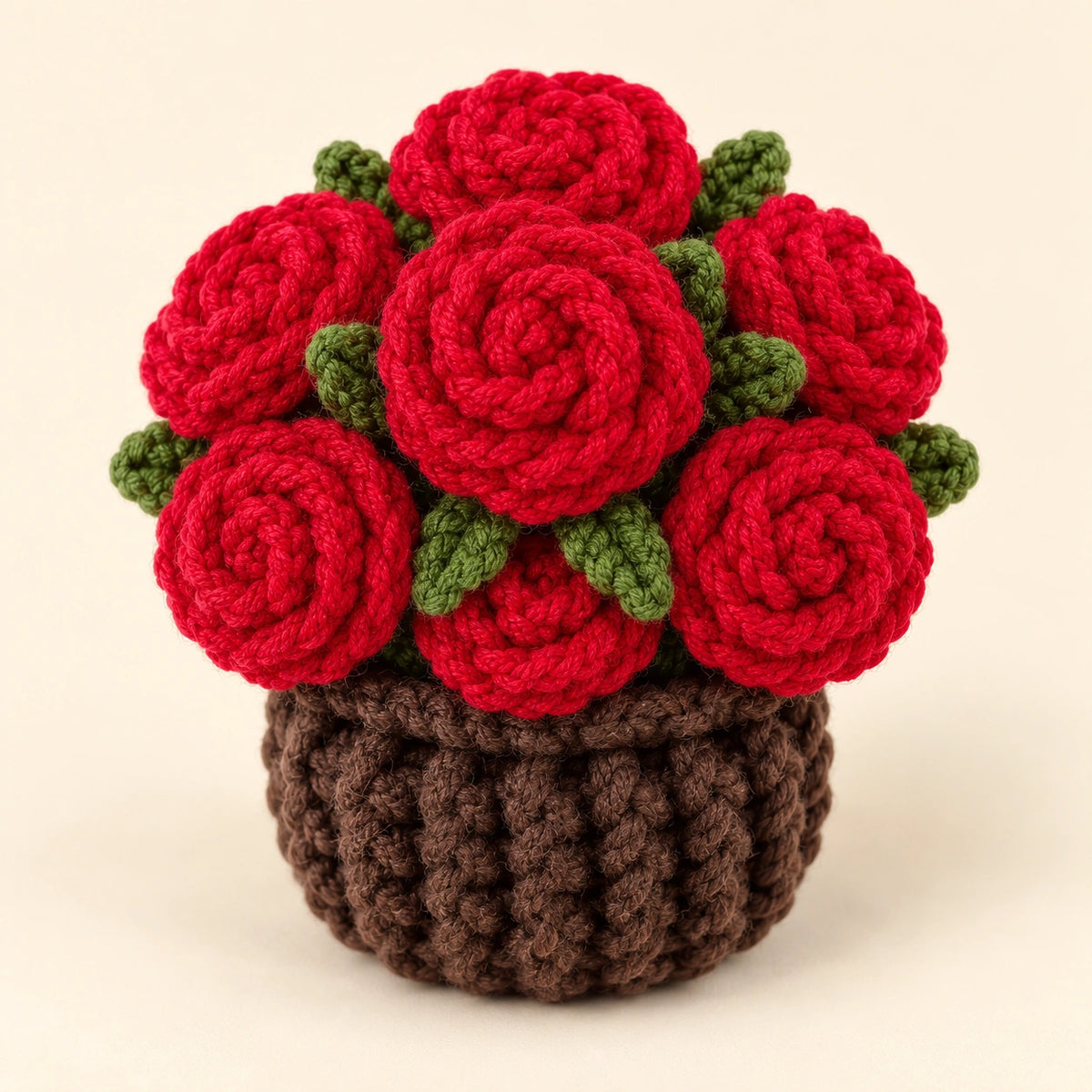 Rose coaster tucked into its brown crochet base